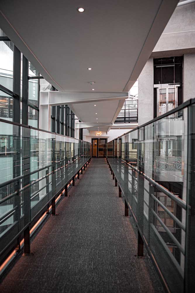brown-gray-hallway-with-glass-windows